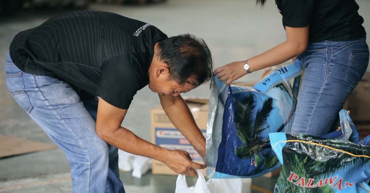 SAWO staff members coordinating the preparation of relief supplies for Cebu residents