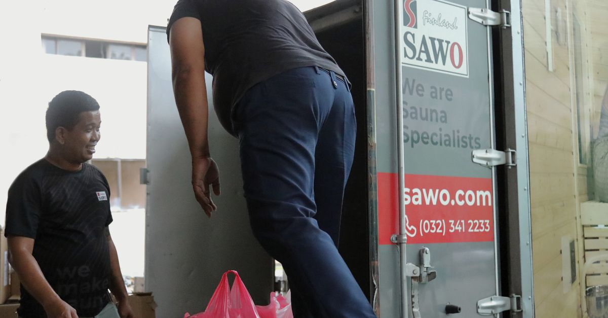 Team SAWO loading prepared relief goods to support earthquake-affected areas in Cebu