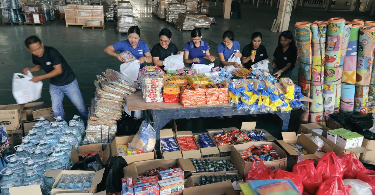 SAWO staff organizing donated goods for earthquake relief operations